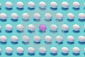 Single colored egg among white eggs solid color background
