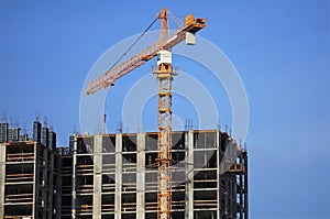 Single construction crane at the construction site