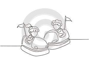 Single continuous line drawing children driving bumper car. Happy smiling boy and girl on bumper auto wheel attraction at