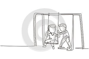 Single continuous line drawing cute little boy swinging on swing and his friend helped push from behind. Happy preschool kids