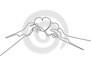Single continuous line drawing of cute young happy man ad woman couple holding heart shaped paper and unite it together. Romantic