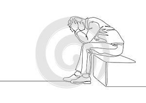 Single continuous line drawing of depression young worker sitting on chair and holding his head because of confused. Work pressure