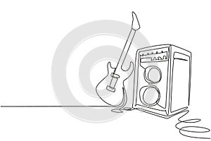 Single continuous line drawing electric guitar with amplifier. Rock music illuminated stage background with microphone electric