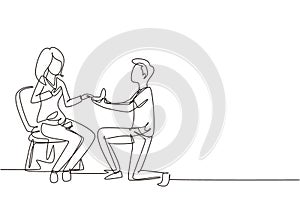 Single continuous line drawing man makes marriage proposal woman and gives ring. Happy couple getting ready for wedding. Bride and