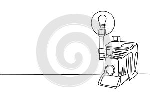 Single continuous line drawing of old retro analog camera medium format with blitz flash light. Vintage photography equipment photo