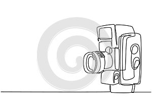 Single continuous line drawing of old vintage analog movie film camera medium format. Classic retro photography equipment concept