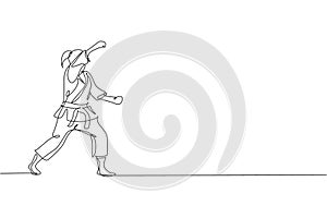 Single continuous line drawing of young confident karateka girl in kimono practicing karate combat at dojo. Martial art sport