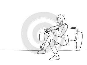 Single continuous line drawing of young female worker get relax by sitting on the sofa while holding a cup of coffee drink.