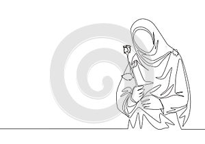 Single continuous line drawing of young happy cute muslimah with headscarf holding a flower rose. Beauty Asian woman model in