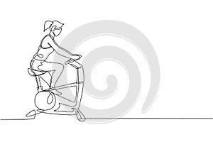 Single continuous line drawing of young happy woman exercising with static bike in sport center gym club. Sport training fitness