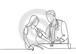 Single continuous line drawing of young male doctor examining young woman patient pulse rate and blood pressure using tensiometer