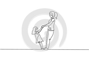 Single continuous line drawing of young mother and her daughter holding hands and dancing together at home. Happy family parenting