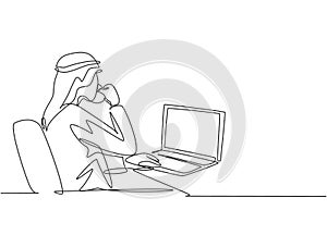 Single continuous line drawing of young muslim businessmen typing business proposal draft on laptop. Arab middle east cloth shmagh photo