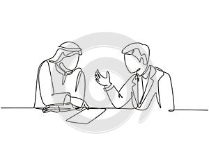 Single continuous line drawing of young muslim discussing business deal  project with his colleague. Arab middle east cloth shmagh photo