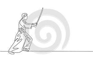 Single continuous line drawing of young sportive man wearing kimono practice aikido fighting technique with wooden sword. Japanese