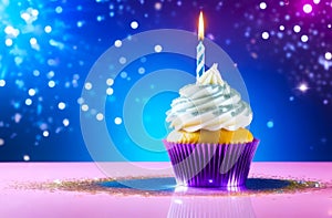 single cupcake adorned with white frosting, glitter and lit birthday candle, soft bokeh background. concepts: birthday