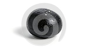 A single dark round object with textured surface casting a shadow