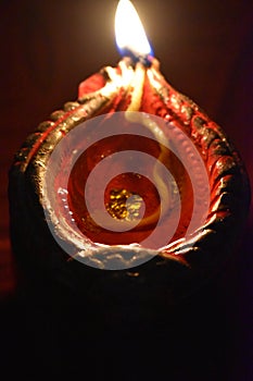 Single diya disigning burning in mastered oil in ocation of diwali