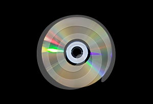 Single DVD-RW disc on black .