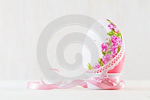 Single easter egg on wooden table. Decoupage art