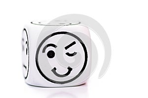 Single emoticon dice with blinking expression sketch