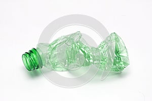Single empty green plastic bottle on white background. Waste recycling concept. Garbage. Isolation on white.