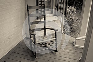 Single Empty Rocking Chair On Front Porch