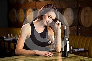 Single female alone at restaurant bar drinking wine alone seductive flirt