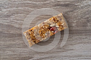 Single flax and almond seed granola bar on a table