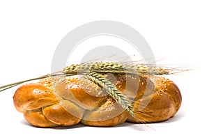 Single fresh bun and ear of wheat