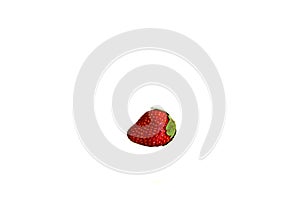 Single fresh red strawberry isolated on white background