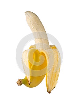 Single fresh, yellow, ripe banana half peeled photo