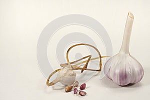 Garlic bulb and bulbil on white background photo