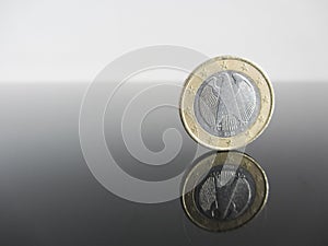 Single German Euro coins on grey background