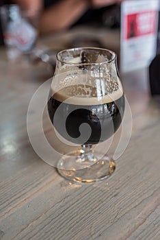 single glass of dark stout beer