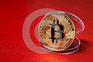 Single Golden Bitcoin Coin on red background. Bitcoin cryptocurrency. Business concept.