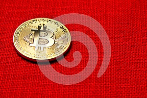Single Golden Bitcoin Coin on red background. Bitcoin cryptocurrency. Business concept.