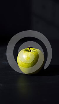 Single Green Apple on Slate photo