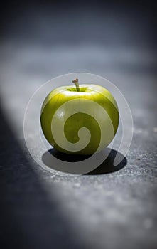 Single Green Apple on Slate photo