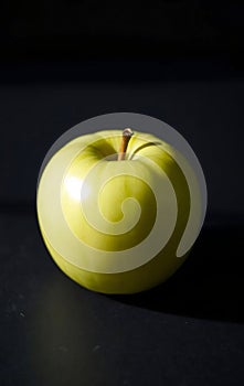 Single Green Apple on Slate photo