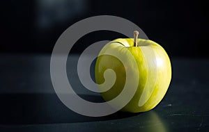 Single Green Apple on Slate photo