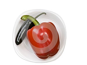 Single green jalapeno pepper and red bell isolated on white background