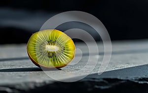 Single Green Kiwi Half on Slate photo