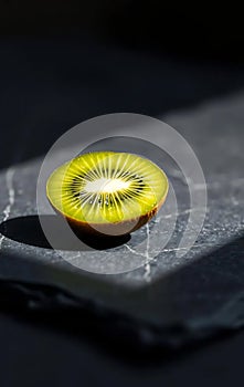 Single Green Kiwi Half on Slate photo