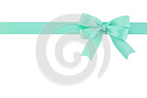 Single green mint ribbon with bow isolated on white background