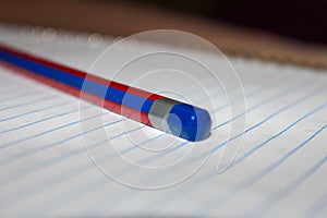 Single isolated pencil over a scribbling pad