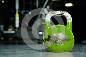 Single kettlebell on the gym floor ready to use for strength and conditioning training sport concept