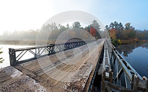 Single lane steel and timber bridge over Corry Lake.