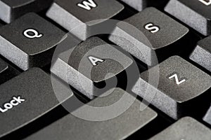 A single letter A key on a simple black office desktop PC computer keyboard, object detail, macro, extreme closeup, nobody