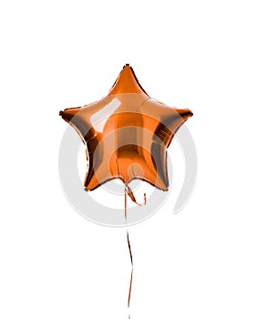 Single light orange color metallic star balloon object for birthday party isolated on a white